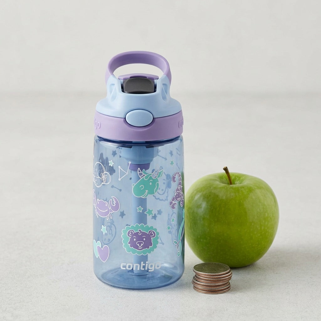 A kids' zodiac water bottle shown next to an apple and coins for a clear size comparison.