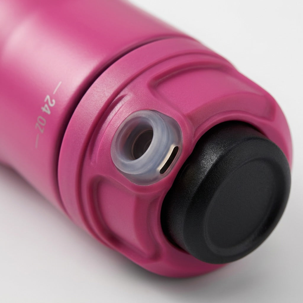 An extreme close-up of the AUTOSPOUT system, highlighting the fine spout opening and a small valve.