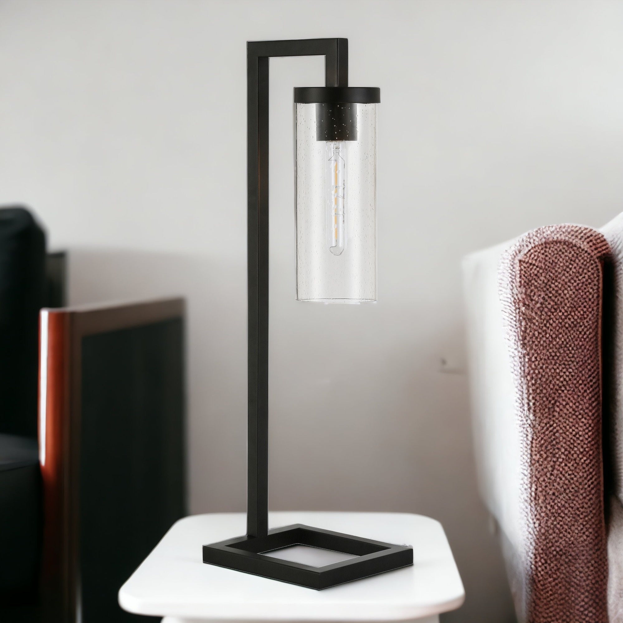 26" Black Metal Arched Table Lamp With Clear Seeded Cylinder Shade 