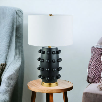 26" Black and Gold Ceramic Abstract Table Lamp With White Drum Shade 
